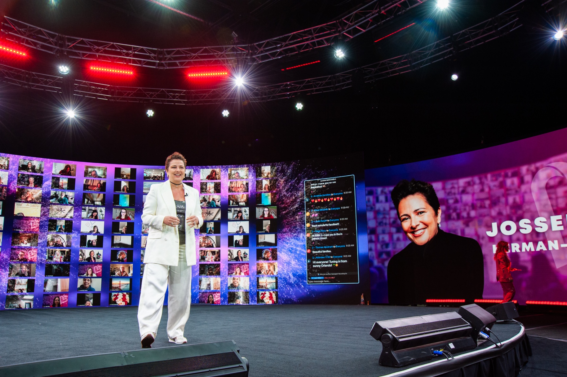 Josselyne speaking on a large stage to a global audience